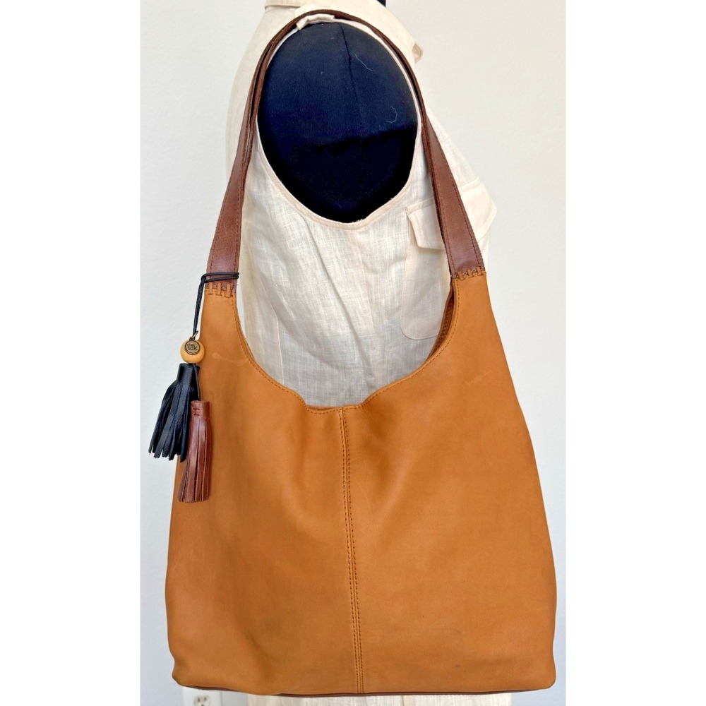 The Sak Women's Huntley‎ Leather Hobo Bag Metro Sling Pebbled Tan with Tassel